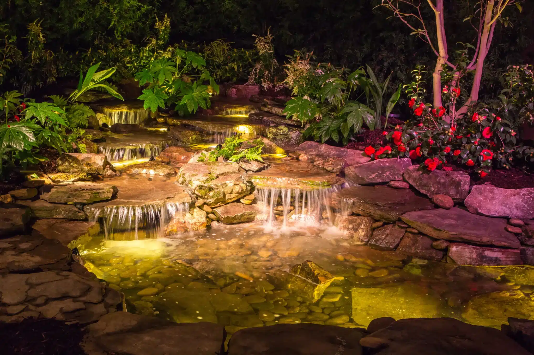 Garden water feature with discreet lighting
